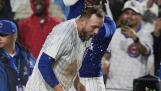 Chicago Cubs' Michael Busch gets doused as he celebrates his walk-off home run with his team to beat the San Diego Padres 3-2 in a baseball game Tuesday, May 7, 2024, in Chicago. (AP Photo/Erin Hooley)