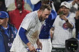 Chicago Cubs' Michael Busch gets doused as he celebrates his walk-off home run with his team to beat the San Diego Padres 3-2 in a baseball game Tuesday, May 7, 2024, in Chicago. (AP Photo/Erin Hooley)
