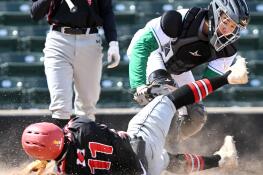 York catcher Owen Chael tags out Maine South’s Chris Gonzalo, who was attempting to steal home to win the game with the score at 8-8 in the top of the seventh inning at Wintrust Field on Wednesday, March 27, 2024 in Schaumburg.