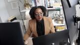 Chantel Adams, a senior marketing executive, sits in her home office in Durham, North Carolina. Adams says she isn’t surprised the gender pay gap persists even among men and women with the same level and quality of education, or that the gap is wider for Black and Hispanic women.