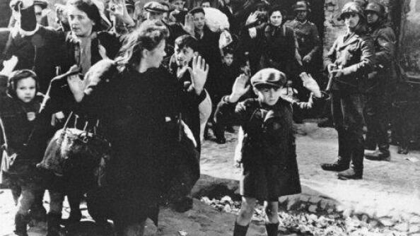German soldiers watch as a group of Jews are escorted from the Warsaw Ghetto in 1943. A Netflix documentary explores the notion that otherwise respectable men committed atrocities against Jews in Poland simply because they felt social pressure.
