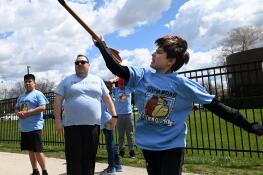 Peter Fleming throws the javelin under the direction of Pat Hurst, head coach of the Special Olympics team and the physical education teacher High Road School, as Fleming and fellow students practice at Maple Trail Park for this weekend’s Special Olympics in Mount Prospect.