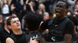 Glenbard North’s Jack Schager, left, celebrates with teammates JJ Hernandez, middle, and Josh Abushanab after he hit a buzzer-beater to win the game 44-43 over York during the final of the Addison Trail Sectional on Friday, March 1, 2024 in Addison.