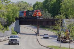 A Canadian National train sits at the railroad overpass over Route 45 just north of Route 176 in Mundelein on Friday. The rail company had planned to shut down the roadway next week to inspect the bridge, but the work has been postponed until the company gets a permit from the Illinois Department of Transportation.