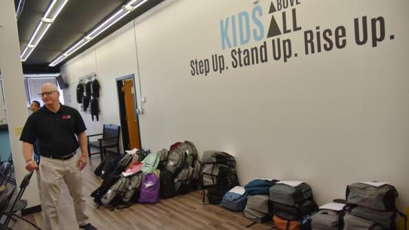 Dan Kotowski, president and CEO of Kids Above All, stands near backpacks ready to be delivered during the annual Back-To-School Backpack Drive at the Better Life Distribution Center in Des Plaines.