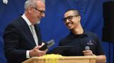 Lincoln Elementary School custodian Mario Diaz Albarran, right, was all smiles Monday as Illinois State Superintendent Tony Sanders helped congratulate him on winning the national Recognizing Inspiring School Employees Award.