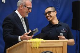 Lincoln Elementary School custodian Mario Diaz Albarran, right, was all smiles Monday as Illinois State Superintendent Tony Sanders helped congratulate him on winning the national Recognizing Inspiring School Employees Award.