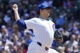 Cubs starting pitcher Javier Assad throws against the Milwaukee Brewers Sunday during the first inning at Wrigley Field.