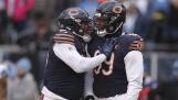 Chicago Bears defensive end DeMarcus Walker (95) and Chicago Bears defensive tackle Gervon Dexter Sr. (99) react after a play during an NFL football game, Sunday, Dec. 10, 2023, in Chicago. (AP Photo/Melissa Tamez)