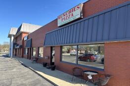 Munchies Pizza, at 25 Turner Ave. in Elk Grove Village, is in a lease dispute with village officials who plan to demolish the building by fall.