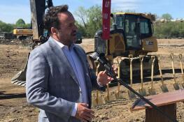 Louis Schriber III, founding partner and CEO of Shorewood Development Group, addresses the audience at the groundbreaking Wednesday for the Bison Crossing development. The $100 million development on Dundee Road between Old Arlington Heights Road and Bison Park will house a Tesla sales and service center, a 224-unit apartment building and 30,000 to 40,000 square feet of retail space.
