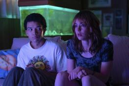 Maddy (Brigette Lundy-Paine) introduces Owen (Justice Smith) to “The Pink Opaque,” a horror-esque series on cable in “I Saw the TV Glow.”