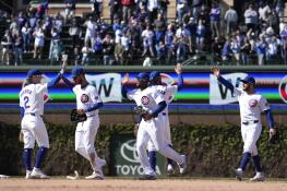 The Chicago Cubs celebrate the team's 8-3 win over the Miami Marlins in a baseball game Friday, April 19, 2024, in Chicago. (AP Photo/Charles Rex Arbogast)
