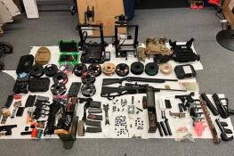 Guns, gun parts and other evidence seized by the Lake County sheriff’s office at a home in Grayslake.