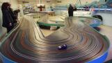 A car rounds a turn on a track at Dads Slot Cars in Des Plaines, which closed permanently Sunday.