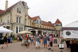 Customers peruse the goods at the farmers market outside The Dole Mansion in Crystal Lake.