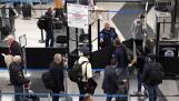 Travelers line up at a security checkpoint area in Terminal 3 at O'Hare International Airport in Chicago.