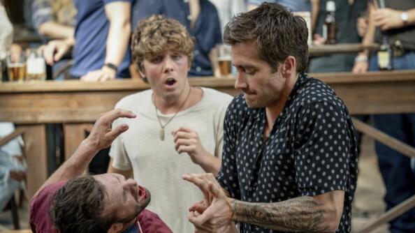 Jake Gyllenhaal, right, plays a former UFC fighter hired as security for a seedy Florida Keys bar in Doug Liman’s remake of the 1989 cult classic “Road House.” It debuts Thursday on Prime Video.
