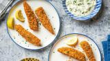 Crispy Baked Fish Fingers are far superior to the frozen boxed varieties, and homemade tartar sauce makes them a meal.
